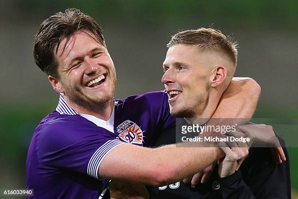 Alex Grant of the Glory and Andy Keogh celebrates the win during the round three A-League match between Melbourne City FC and Perth Glory at AAMI...