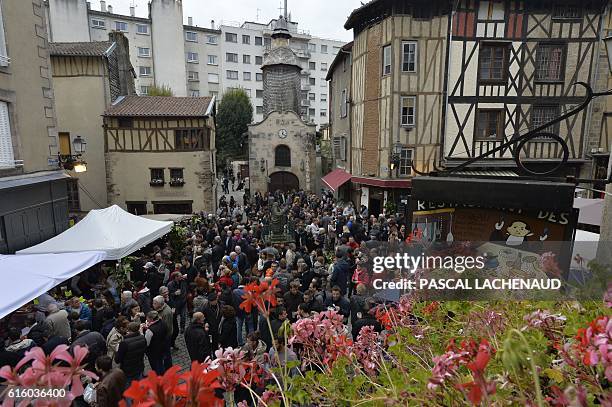 People attend the 43rd "Frairie des Petits Ventres", a traditional gastronomy festival, in Limoges on October 21, 2016. The festival has been held...