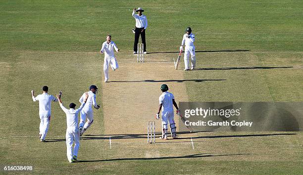 Gareth Batty of England celebrates dismissing Tamin Iqbal of Bangladesh during day two of the first Test between Bangladesh and England at Zohur...