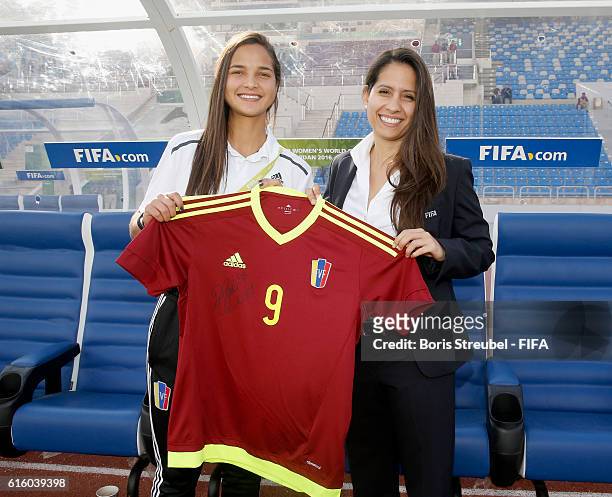 Deyna Castellanos of Venezuela hands a signed jersey for the FIFA museum over to FIFA representative Lorena Magali Soto Giubi prior to the FIFA U-17...