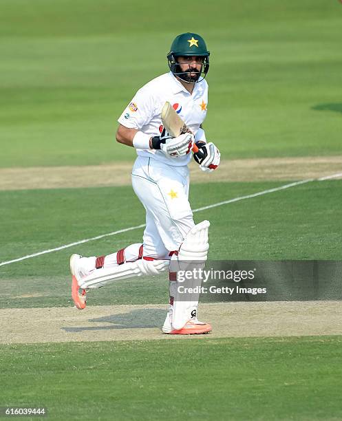 Misbah Ul Haq scores a run during Day One of the Second Test between Pakistan and the West Indies at the Zayed Cricket Stadium on October 21, 2016 in...