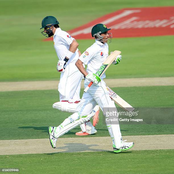 Misbah Ul Haq and Younis Khan scoring a run during Day One of the Second Test between Pakistan and the West Indies at the Zayed Cricket Stadium on...