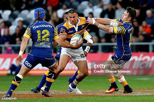 Teddy Stanaway of Bay of Plenty fends off Fletcher Smith of Otago during the Mitre 10 Cup Championship Semi Final between Otago and Bay of Plenty on...