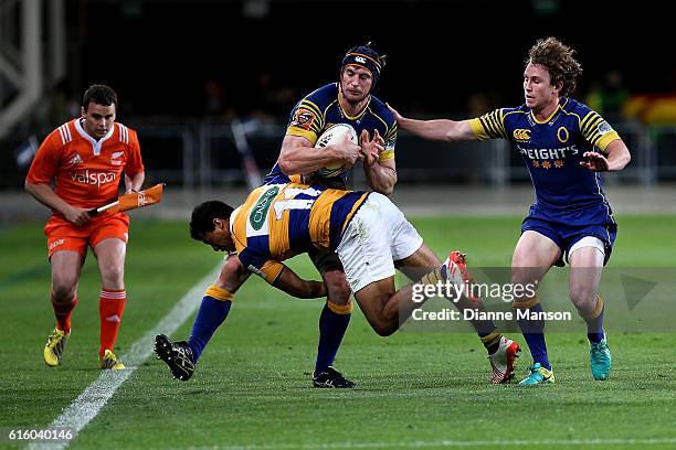 Paul Grant of Otago in the tackle of Regan Ware of Bay of Plenty during the Mitre 10 Cup Championship Semi Final between Otago and Bay of Plenty on...