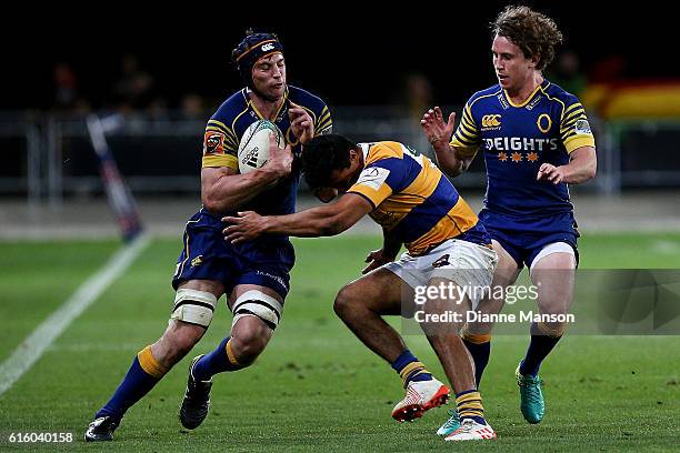 Paul Grant of Otago fends off Regan Ware of Bay of Plenty during the Mitre 10 Cup Championship Semi Final between Otago and Bay of Plenty on October...