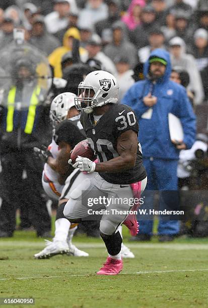 SaQwan Edwards of the Oakland Raiders returns a kickoff against the Kansas City Chiefs during an NFL football game at Oakland-Alameda County Coliseum...