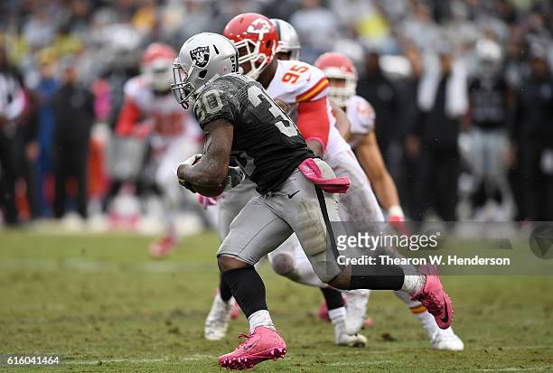 SaQwan Edwards of the Oakland Raiders returns a kickoff against the Kansas City Chiefs during an NFL football game at Oakland-Alameda County Coliseum...