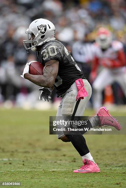 SaQwan Edwards of the Oakland Raiders returns a kickoff against the Kansas City Chiefs during an NFL football game at Oakland-Alameda County Coliseum...