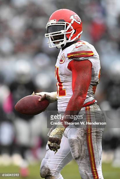 Tamba Hali of the Kansas City Chiefs reacts after recovering a fumble against the Oakland Raiders during an NFL football game at Oakland-Alameda...