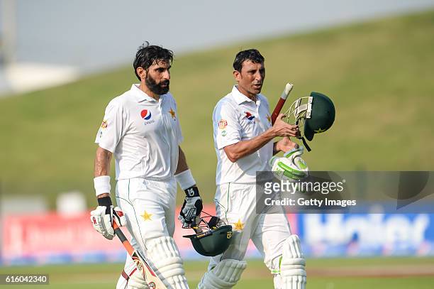 Misbah Ul Haq and Younis Khan leave the ground for tea breakduring Day One of the Second Test between Pakistan and the West Indies at the Zayed...