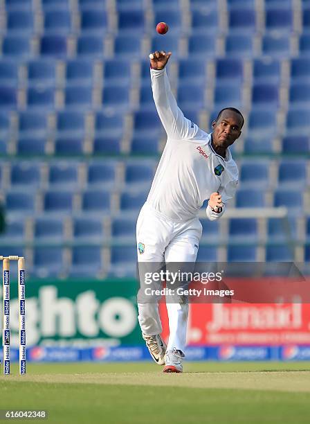 Kraigg Brathwaite bowls during Day One of the Second Test between Pakistan and the West Indies at the Zayed Cricket Stadium on October 21, 2016 in...