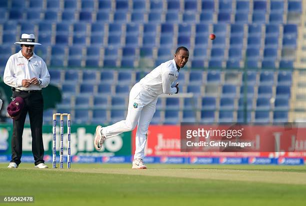 Kraigg Brathwaite bowls during Day One of the Second Test between Pakistan and the West Indies at the Zayed Cricket Stadium on October 21, 2016 in...