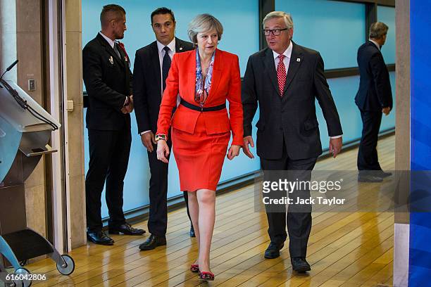 British Prime Minister Theresa May arrives with President of the European Commission Jean-Claude Juncker at the European Commission at the end of a...