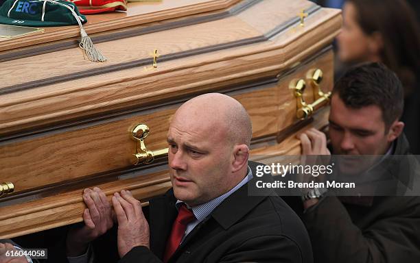 Clare , Ireland - 21 October 2016; Former Munster player John Hayes and Munster captain Peter O'Mahony carry the coffin of Munster Rugby head coach...