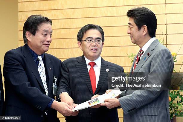 Japanese Prime Minister Shinzo Abe meets Nagoya City mayor Takashi Kawamura and Aichi Prefecture Governor Hideaki Omura at his official residence on...