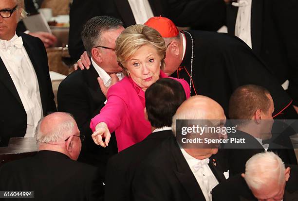 Hillary Clinton speak to attendees at the annual Alfred E. Smith Memorial Foundation Dinner at the Waldorf Astoria on October 20, 2016 in New York...