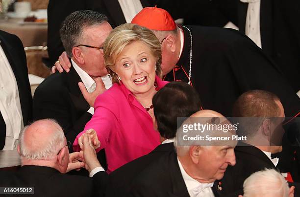Hillary Clinton speak to attendees at the annual Alfred E. Smith Memorial Foundation Dinner at the Waldorf Astoria on October 20, 2016 in New York...