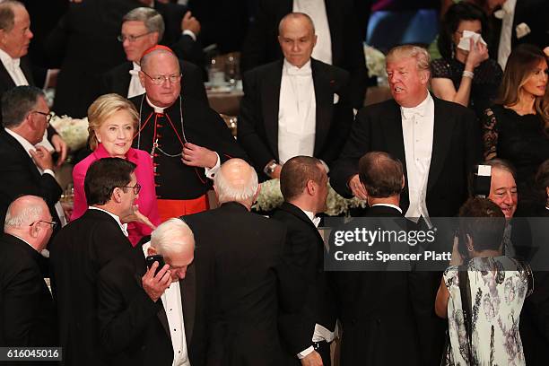 Hillary Clinton and Donald Trump attend the annual Alfred E. Smith Memorial Foundation Dinner at the Waldorf Astoria on October 20, 2016 in New York...