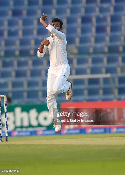 Devendra Bishoo bowls during Day One of the Second Test between Pakistan and the West Indies at the Zayed Cricket Stadium on October 21, 2016 in Abu...