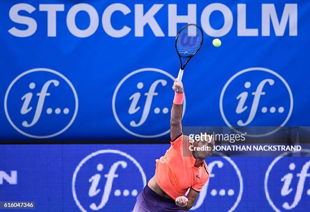 Argentina's Juan Martin Del Potro serves the ball to Croatia's Ivo Karlovic during the ATP Stockholm Open tennis tournament in Stockholm on October...