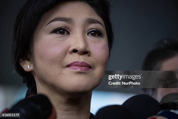 Thailand's former Prime Minister Yingluck Shinawatra speaks to media upon her arrival at the Supreme Court in Chaeng Wattana Government Complex,...