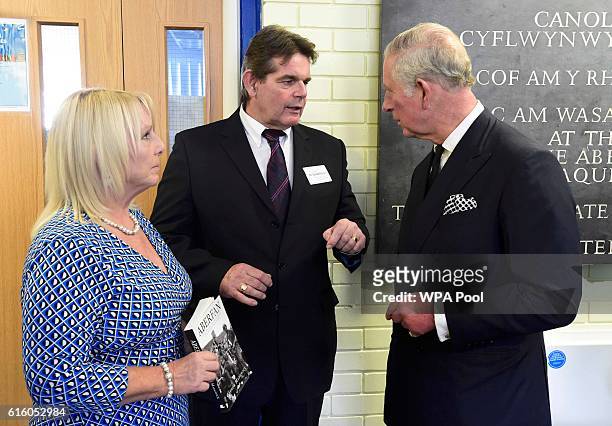 Prince Charles, Prince of Wales speaks with survivors Gaynor Madgwick and Gerald Kirwan, during a visit to mark the 50th Anniversary of the Aberfan...