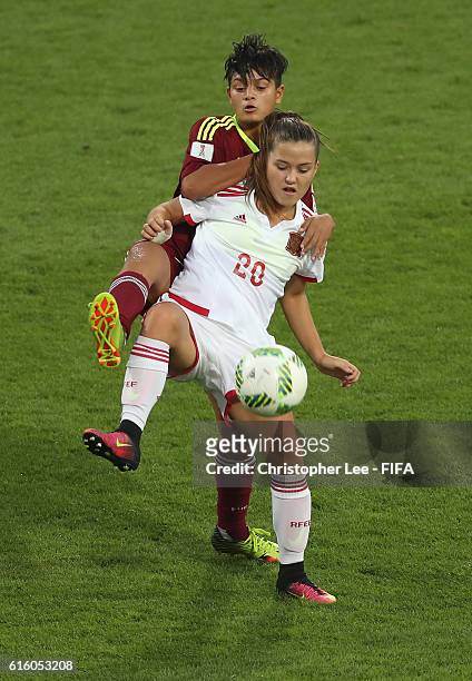 Claudia Pina of Spain holds off Hilary Vergara of Venezuela during the FIFA U-17 Women's World Cup Jordan 2016 Third Place Play-Off match between...