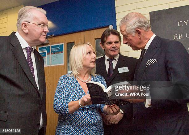 Prince Charles, Prince of Wales speaks with survivors Jeff Edwards Gaynor Madgwick and Gerald Kirwan , during a visit to mark the 50th Anniversary of...