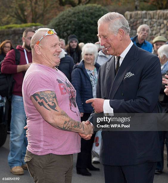 Prince Charles, Prince of Wales meets Shaun Edwards as he visits the Aberfan Memorial Garden and meets villagers as they mark the 50th Anniversary of...