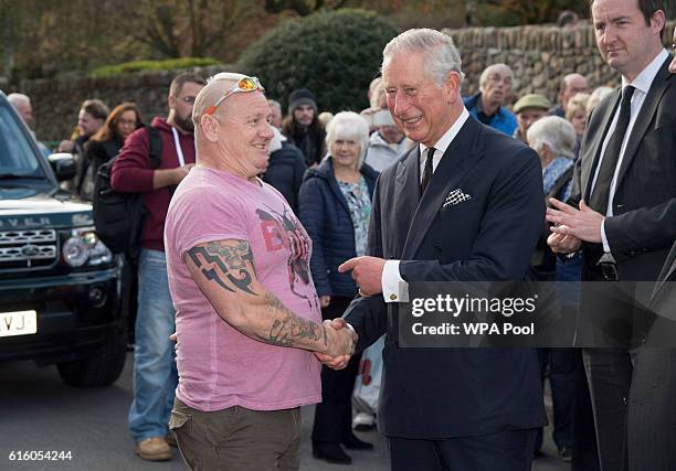 Prince Charles, Prince of Wales meets Shaun Edwards as he visits the Aberfan Memorial Garden and meets villagers as they mark the 50th Anniversary of...