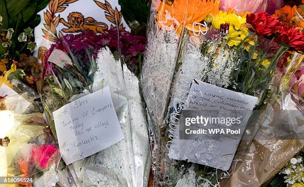 Flowers are left at the Aberfan Memorial Garden to mark the 50th Anniversary of the Aberfan disaster on October 21, 2016 in Aberfan, Wales.