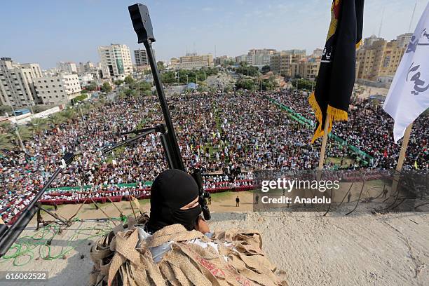 Members of Palestinian Islamic Jihad Movement attend a ceremony held to mark the 29th foundation anniversary of PIJ at the El Katibe Square in Gaza...