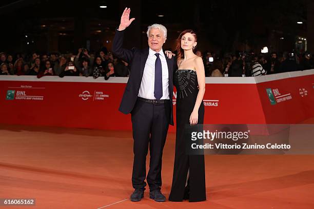 Michele Placido and Federica Vincenti walk a red carpet for '7 Minuti' during the 11th Rome Film Festival at Auditorium Parco Della Musica on October...