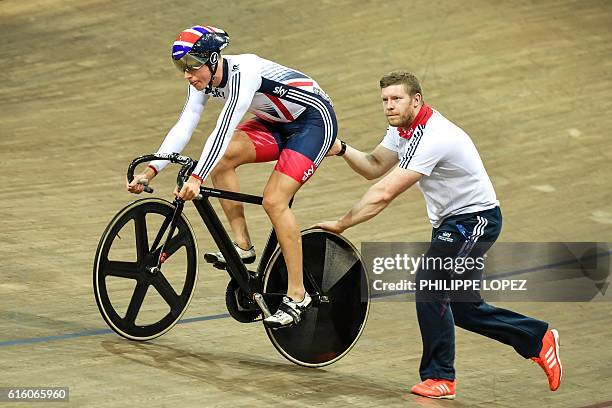 Britain's Joseph Truman is pushed on the track during the men's sprint quarter-finals during the European Track Championships in...