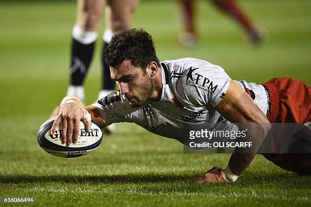 Toulon's French flanker Charles Ollivon scores a try during the European Rugby Champions Cup rugby union round 2 match between Sale Sharks and Toulon...