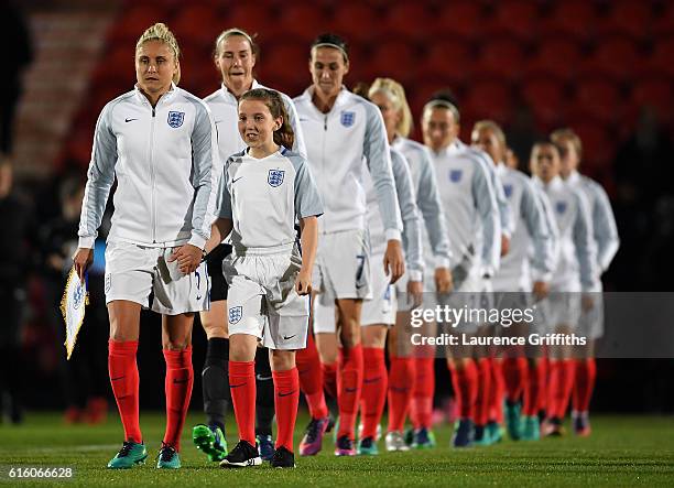 Steph Houghton of England leads the team out during the International Friendly between England and France at Keepmoat Stadium on October 21, 2016 in...