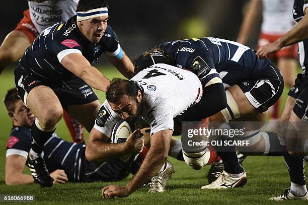 Toulon's Georgian lock Mamuka Gorgodze is tackled during the European Rugby Champions Cup rugby union round 2 match between Sale Sharks and Toulon at...