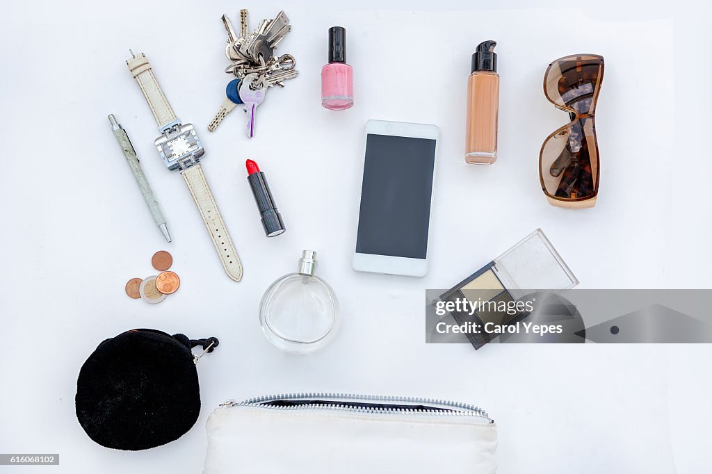 Dressing case with a lot of feminine objects.