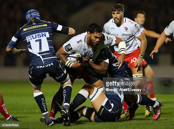 Romain Taofifenua of RC Toulon is tackled by Brian Mujati and Andrei Ostrikov of Sale Sharks during the European Rugby Champions Cup match between...
