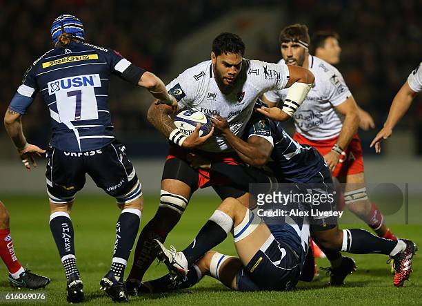 Romain Taofifenua of RC Toulon is tackled by Brian Mujati and Andrei Ostrikov of Sale Sharks during the European Rugby Champions Cup match between...