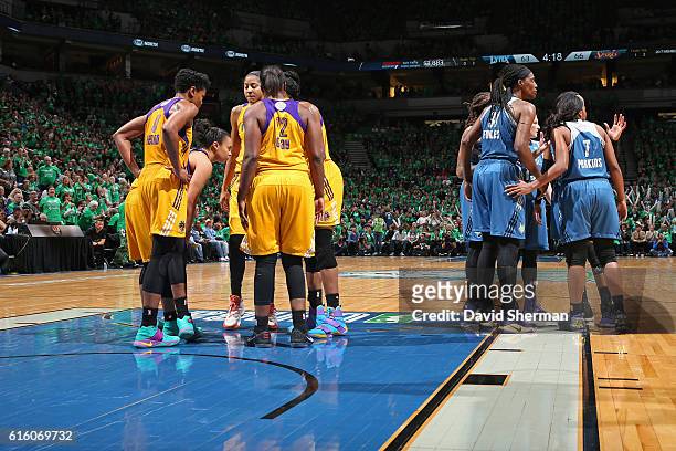 The Los Angeles Sparks and the Minnesota Lynx huddle up on the court during Game Five of the 2016 WNBA Finals on October 20, 2016 at Target Center in...