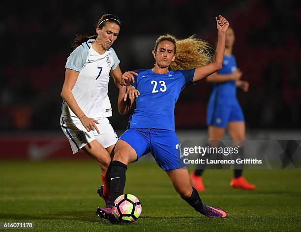 Kheira Hamraoui of France battles with Jill Scott of England during the International Friendly between England and France at Keepmoat Stadium on...