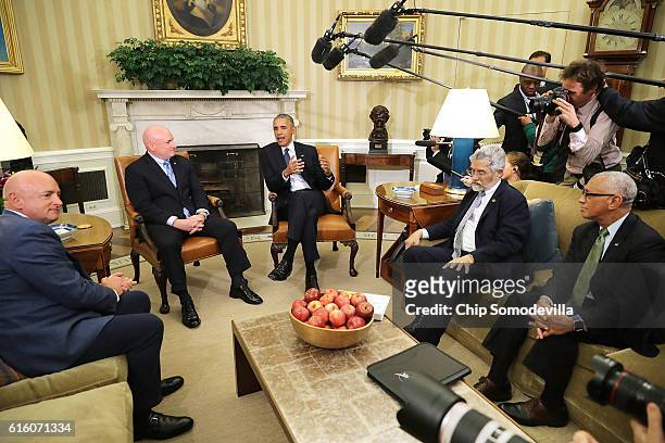 President Barack Obama delivers remarks after meeting with retired NASA astronaut Scott Kelly in the Oval Office with Kelly's twin brother Mark Kelly...