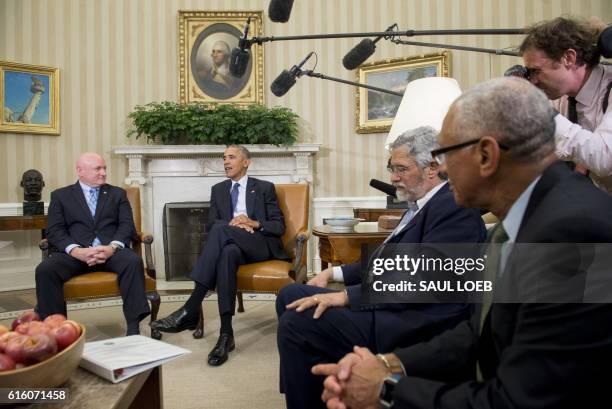 President Barack Obama meets with NASA astronaut Scott Kelly, alongside White House Science Adviser John Holdren and NASA Administrator Charlie...