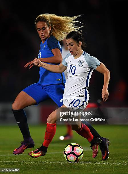 Karen Carney of England battles with Kheira Hamraoui of France during the International Friendly between England and France at Keepmoat Stadium on...