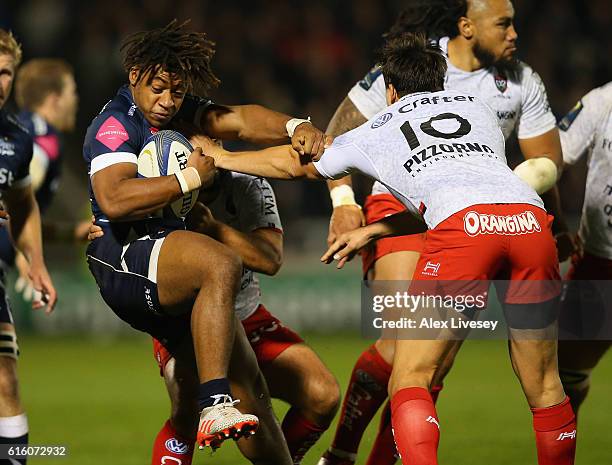 Paolo Odogwu of Sale Sharks is tackled by Francois Trinh-Duc of RC Toulon during the European Rugby Champions Cup match between Sale Sharks and RC...