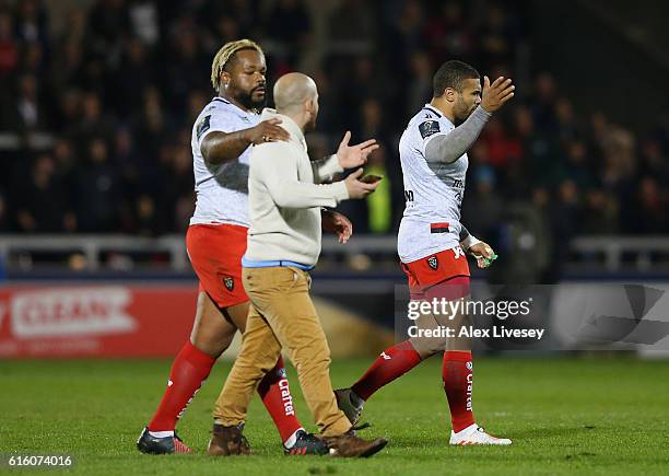 Bryan Habana of RC Toulon clashes with a pitch invader during the European Rugby Champions Cup match between Sale Sharks and RC Toulonon at AJ Bell...