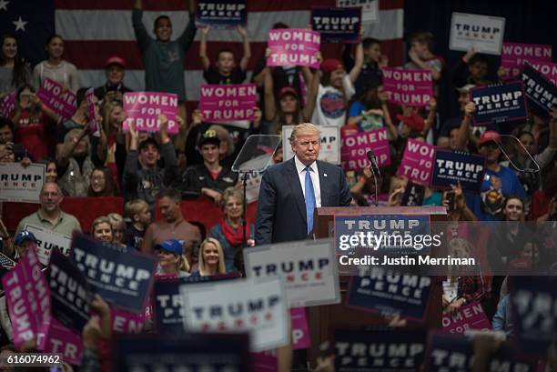 Republican presidential candidate Donald Trump pauses as the crowd cheers for him during a campaign stop at the Cambria County War Memorial Arena on...