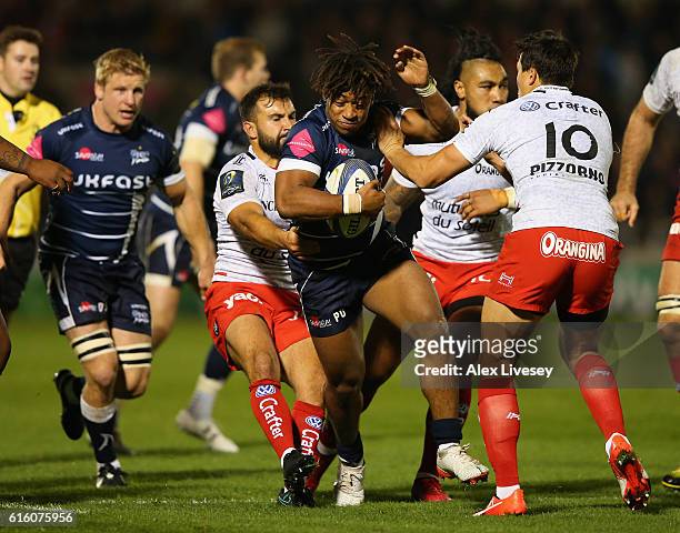 Paolo Odogwu of Sale Sharks is tackled by Eric Escande and Francois Trinh-Duc of RC Toulon during the European Rugby Champions Cup match between Sale...