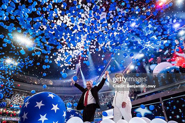 Democratic presidential nominee Hillary Clinton and her running mate Tim Kaine wave to the crowd at the Wells Fargo Center in Philadelphia, Pa., on...